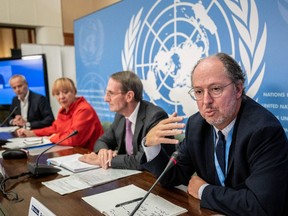 Member of the Independent International Commission of Inquiry on Ukraine Pablo de Greiff (R) gestures next to Chair of the Commission Erik Mose (2R) members of the Commission Jasminka Dzumhur (2L) and UN Human Right Council spokesman Rolando Gomez in Geneva, on Sept. 23.