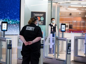 A 2021 file photo of an Edmonton International Airport security checkpoint. A 37-year-old Fort McMurray man is facing charges including aggravated assault after allegedly running through the checkpoint and injuring an RCMP officer with a piece of cutlery.