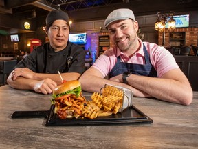 The Brigade Burger, served at Cork & Barley. Cook, Norman Valenzuela is on the left with owner, Desmond Derouin on the right. Taken on Saturday, Sept. 3, 2022 in Edmonton. Greg Southam/Postmedia