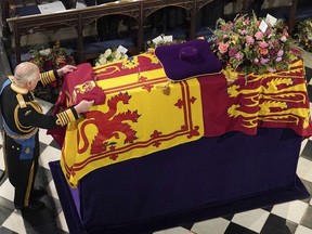 King Charles III places the Queen's Company Camp Colour of the Grenadier Guards on the coffin at the Committal Service for Queen Elizabeth II, held at St George's Chapel in Windsor Castle, Monday Sept. 19, 2022. Nova Scotia spent $8.3 million to mark Queen Elizabeth's death with a provincial day of mourning.