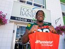 Edmonton Elks player Kony Ealy, part  of this year's Purolator Tackle Hunger team ambassadors, lends a hand during a visit to Edmonton's Food Bank on Thursday, Sept. 22, 2022.