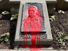 Red paint has been splashed on the Frank Oliver monument in Frank Oliver Park, 6166 100 St., in Edmonton Friday July 2, 2021. Frank Oliver was an Edmonton-based federal member of parliament and minister who was instrumental in the removal of Indigenous people from their land by introducing the Oliver Act. Photo by David Bloom