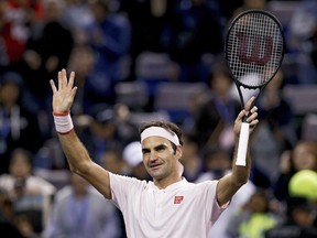FILE - Roger Federer of Switzerland waves to spectators after defeating Daniil Medvedev of Russia in their men's singles match of the Shanghai Masters tennis tournament at Qizhong Forest Sports City Tennis Center in Shanghai, China, Oct. 10, 2018. Federer announced Thursday, Sept. 15, 2022 he is retiring from tennis.