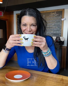 Karyn Decore enjoys a break from running her two hotels in Jasper to enjoy a cup of organic coffee at her Wicked Cup restaurant. SUPPLIED