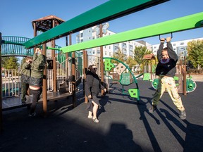 Children play on the Boyle Street playground after the grand opening of a much-needed space in the inner city on Saturday, Sept. 24, 2022, in Edmonton.