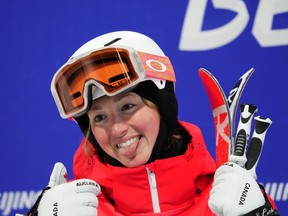 Chloé Dufour-Lapointe, of Canada, smiles after her run during women's moguls finals at the Beijing Winter Olympics in Zhangjiakou, China, on Sunday, Feb. 6, 2022. Six months after becoming the first Canadian freestyle skier to compete in four Olympic Games, Chloe Dufour-Lapointe is retiring.