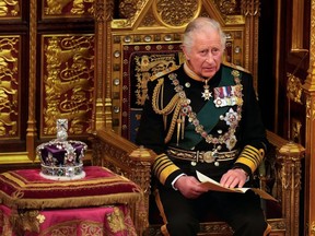 LONDON, ENGLAND - MAY 10: Prince Charles, Prince of Wales reads the Queen's speech next to her Imperial State Crown in the House of Lords Chamber, during the State Opening of Parliament in the House of Lords at the Palace of Westminster on May 10, 2022 in London, England.