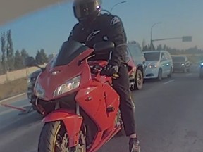 Edmonton police are searching for the rider of this motorcycle, which they say struck a police officer working. (Supplied photo/Edmonton police)