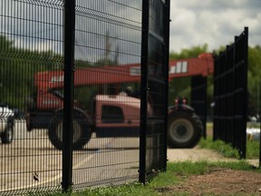 New fencing is constructed around Benson Elementary School, Thursday, Aug. 25, 2022, in Uvalde, Texas. Following the shootings at Robb Elementary, new fencing is being installed on all campuses.