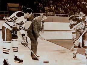 Alberta Oilers captain Al Hamilton participated in four ceremonial faceoffs in a week, this one in Winnipeg Arena with Jets captain Ab McDonald. Winnipeg owner Ben Hatskin performed the honours.