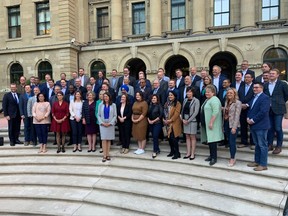 Danielle Smith pose with the Alberta UCP caucus at Calgary's McDougall Centre, Friday, Oct. 7, 2022.