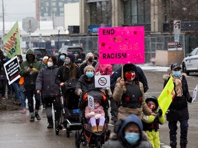 People take part in the bridges against hate march to support BIPOC communities against racism and violence. Taken on Saturday, March 27, 2021, in Edmonton.