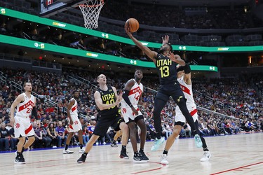 Utah Jazz guard Jared Butler (13) takes a shot over Toronto Raptors forward Gabe Brown (44) during the fourth quarter at Rogers Place.
