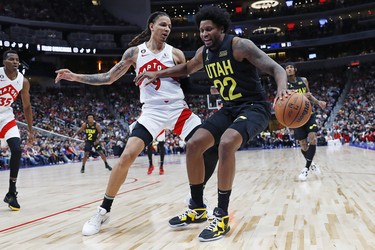 Toronto Raptors forward D.J. Wilson (9) guards Utah Jazz forward Rudy Guy (22) during the fourth quarter at Rogers Place.