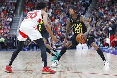 Utah Jazz guard Jordan Clarkson (00) looks to make a pass in front of Toronto Raptors guard Jeff Down Jr. (20) during the third quarter at Rogers Place.