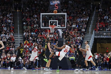 Toronto Raptors center Khem Birch (24) gets knocked down as he takes a shot during the fourth quarter at Rogers Place.