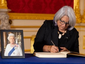 Governor General Mary Simon, signs a book of condolence at Lancaster House in London, following the death of Queen Elizabeth II.