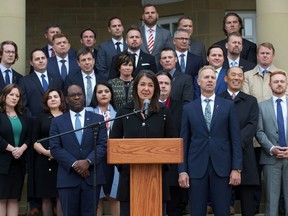 Premier Danielle Smith, front, speaks after her cabinet was sworn in at Government House in Edmonton on Monday, Oct. 24, 2022.