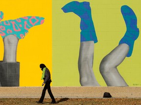 Weather in Edmonton: Average, no more no less 2 A pedestrian walks past a mural, a collaboration between Harnack Art and Marcus Coldway, at Alex Decoteau Park, 10230 105 St., in Edmonton on Tuesday, Oct. 25, 2022.