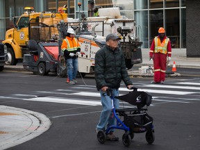 Weather in Edmonton: Average, no more no less 3 Construction crews work on a crosswalk at 101st Street and 103rd Avenue in downtown Edmonton, Tuesday, Oct. 25, 2022.