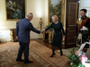 Britain's King Charles shakes hands with British Prime Minister Liz Truss during their weekly audience at Buckingham Palace in London, Britain, Oct. 12.