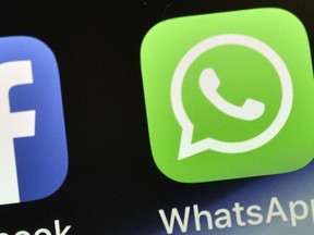 FILE - The WhatsApp icon is seen on an iPhone in Gelsenkirchen, Germany, on Nov. 15, 2018. People around the world are reporting problems sending and receiving messages on the popular chat app WhatsApp. According to Downdetector, which tracks outage reports, people started reporting problems around 3 a.m. EDT. on Tuesday, Oct. 24, 2022.