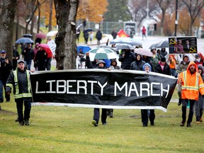 Protesters at the Alberta legislature grounds, in Edmonton Saturday Oct. 23, 2021.