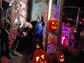 Larry Louis and his nephew Ethan Wong have some fun at Pumpkins After Dark on Friday, September 30, 2022.  A display of more than 6000 hand-carved pumpkins is held in Edmonton's Borden Park from September 29 to October 31, 2022.