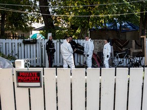 Police investigate the scene of a shooting at a house on the corner of 79 Ave and 106 St in Edmonton, October 8, 2022.