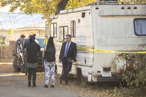 Police investigate the scene of a shooting at a house on the corner of 79 Ave and 106 St in Edmonton, October 8, 2022.