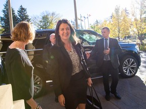 Danielle Smith enters Government House before being sworn in as premier of Alberta on Tuesday, Oct. 11, 2022, in Edmonton.