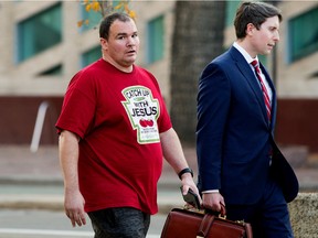 Richard Bradley Stevens leaves the Edmonton courthouse with his lawyer, Monday Oct. 17, 2022. Stevens began a sentencing hearing Monday, months after pleading guilty to assault and mischief for attacking a mother and daughter outside Southgate Centre in December 2020.
