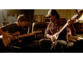 Kaden Noskiye, left, and Corb Lund star in Aaron James' latest film, Guitar Lessons, opening in Edmonton and Calgary Dec. 2.