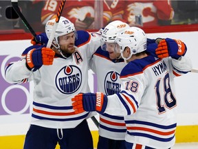 SUNRISE, FL - NOVEMBER 12: Warren Foegele #37 is congratulated by Zach Hyman #18 and Leon Draisaitl #29 of the Edmonton Oilers after Foegele scored in the third on November 12 in the game against the Florida Panthers at FLA Live Arena Period scored, 2022 in Sunrise, Florida.