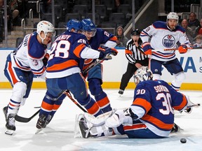 ELMONT, NEW YORK - NOVEMBER 23: A first period shot by Ryan Nugent-Hopkins #93 of the Edmonton Oilers (not shown) gets past Ilya Sorokin #30 of the New York Islanders but fails to enter the net at the UBS Arena on November 23, 2022 in Elmont, New York.