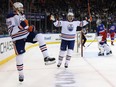 Leon Draisaitl #29, left, of the Edmonton Oilers is joined by Zach Hyman as he celebrates scoring scores the game-winning goal on the powerplay at 17:58 of the third period against the New York Rangers at Madison Square Garden on Saturday, Nov. 26, 2022, in New York City. The Oilers defeated the Rangers 4-3.