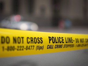 Police tape is shown in Toronto, Tuesday, May 2, 2017. New Statistics Canada data shows there was an increase in homicides in 2021 and nearly one-quarter of the killings were connected to gangs.THE CANADIAN PRESS/Graeme Roy