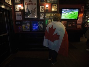 A Canadian soccer fan watches the Team Canada and Team Croatia World Cup match at The Pint Whyte, 8032 104 St., in Edmonton on Sunday, Nov. 27, 2022. Croatia won 4-1.