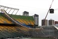 Construction crews work on a snowboard ramp in preparation for The Style Experience, an FIS Snowboard Big Air World Cup event at Edmonton's Commonwealth Stadium. The event is on  Dec. 10, 2022.