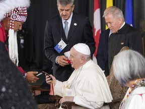 Pope Francis meets with Indigenous leaders as he arrives at Edmonton's International airport, Canada, Sunday, July 24, 2022. Before Pope Francis's arrival in Canada last July, federal officials flagged concerns about the level of consultation done with a First Nations community set to host him.THE CANADIAN PRESS/AP, Gregorio Borgia