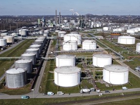 Tanks are seen at a BP oil refinery in Gelsenkirchen, Germany, Monday, March 7, 2022. Crude oil prices slumped to a 10-month low Monday on a report that OPEC plus may hike output at its next meeting.
