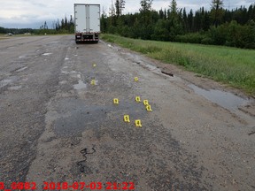 Evidence markers showing the location of artillery shells fired by RCMP members at Clayton Crawford on July 3, 2018.