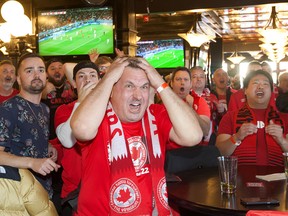 Football fans watch the first half of the World Cup match between Canada and Belgium at Pint Whyte, 8032 104 St., in Edmonton on Wednesday, November 23, 2022.