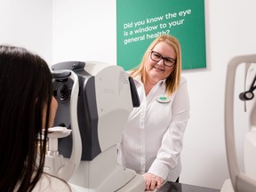 A Specsavers professional performs a 3D eye scan on a patient.   SUPPLIED