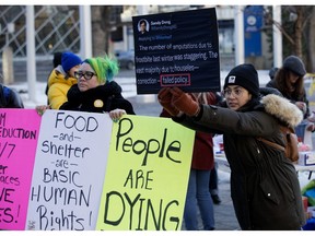 Members of the 4B Harm Reduction Society held a rally outside Edmonton City Hall on Monday, November 21, 2022, in response to statements the city council had failed to provide warm shelter for the city's homeless.