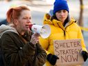 Angie Staines (left) and members of the 4B Harm Reduction Society protest outside Edmonton City Hall on Monday, November 21, 2022. In response to what they say the city council has failed to provide warm shelter for the city's homeless. 