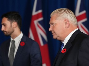 Ontario Premier Doug and Education Minister Stephen Lecce leave after a press conference at Queen's Park in Toronto on Monday Nov. 7, 2022. Ford says he is willing to repeal legislation that imposed a contract on 55,000 education workers and banned them from striking, if the workers' union agrees to end a walkout that's shut many schools.