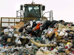 Heavy equipment is used to moved garbage at the Clover Bar landfill when it was still operating in 2005.
