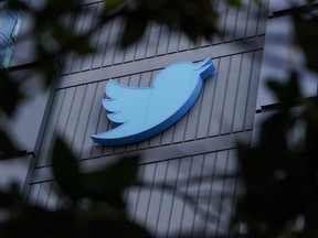 A sign is pictured outside the Twitter headquarters in San Francisco, Wednesday, Oct. 26, 2022. Elon Musk's Twitter takeover has many professionals considering fleeing the social media network, but some say abandoning the platform could hand bad actors exactly want they want from credible voices: silence.