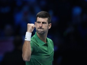 Serbia's Novak Djokovic celebrates after winning against Greece's Stefanos Tsitsipas during their singles tennis match of the ATP World Tour Finals, at the Pala Alpitour in Turin, Italy, Monday, Nov. 14, 2022.